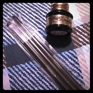 Black liquid eyeliner and brushes